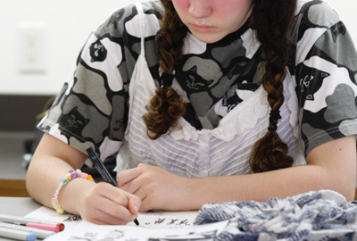 student designing fashion