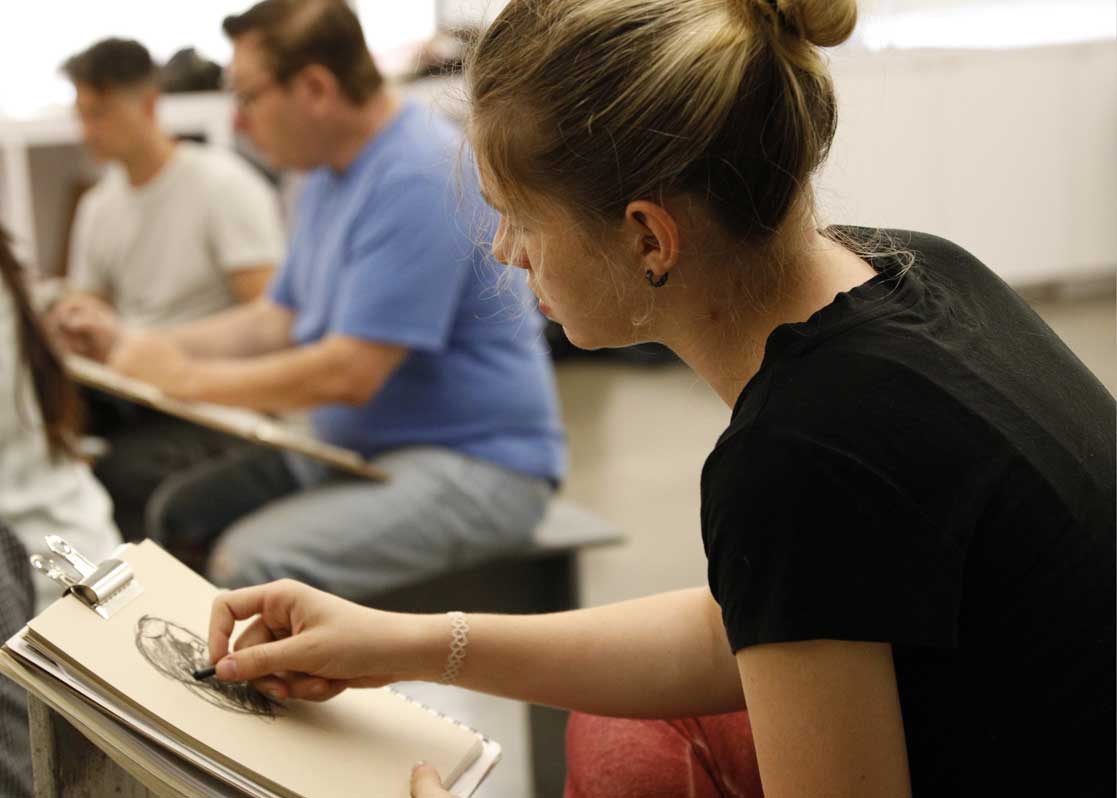 students drawing in class